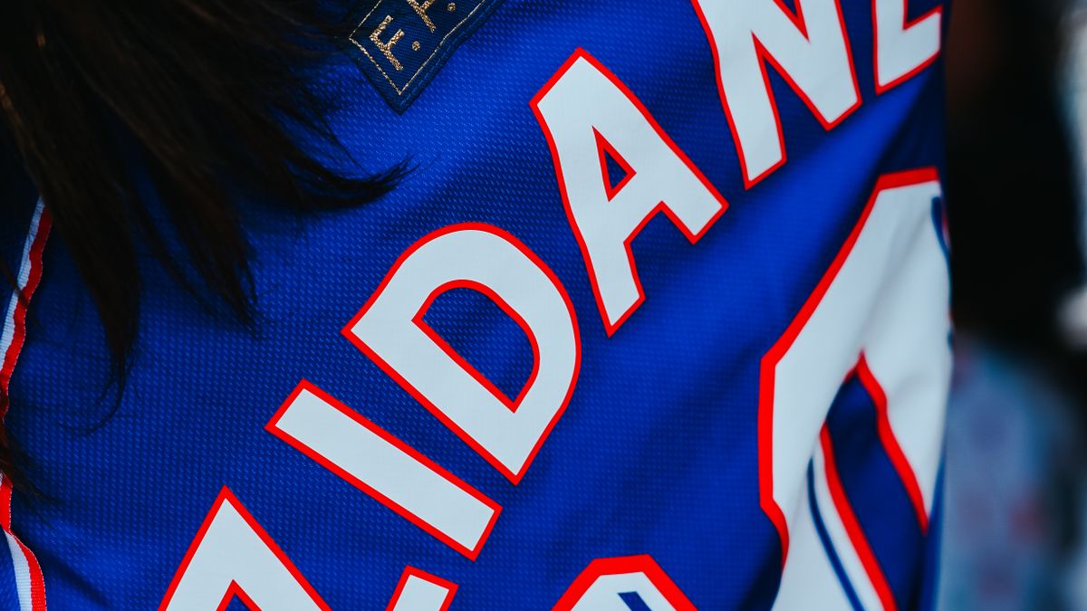 Close-up of a retro soccer jersey with player name and number
